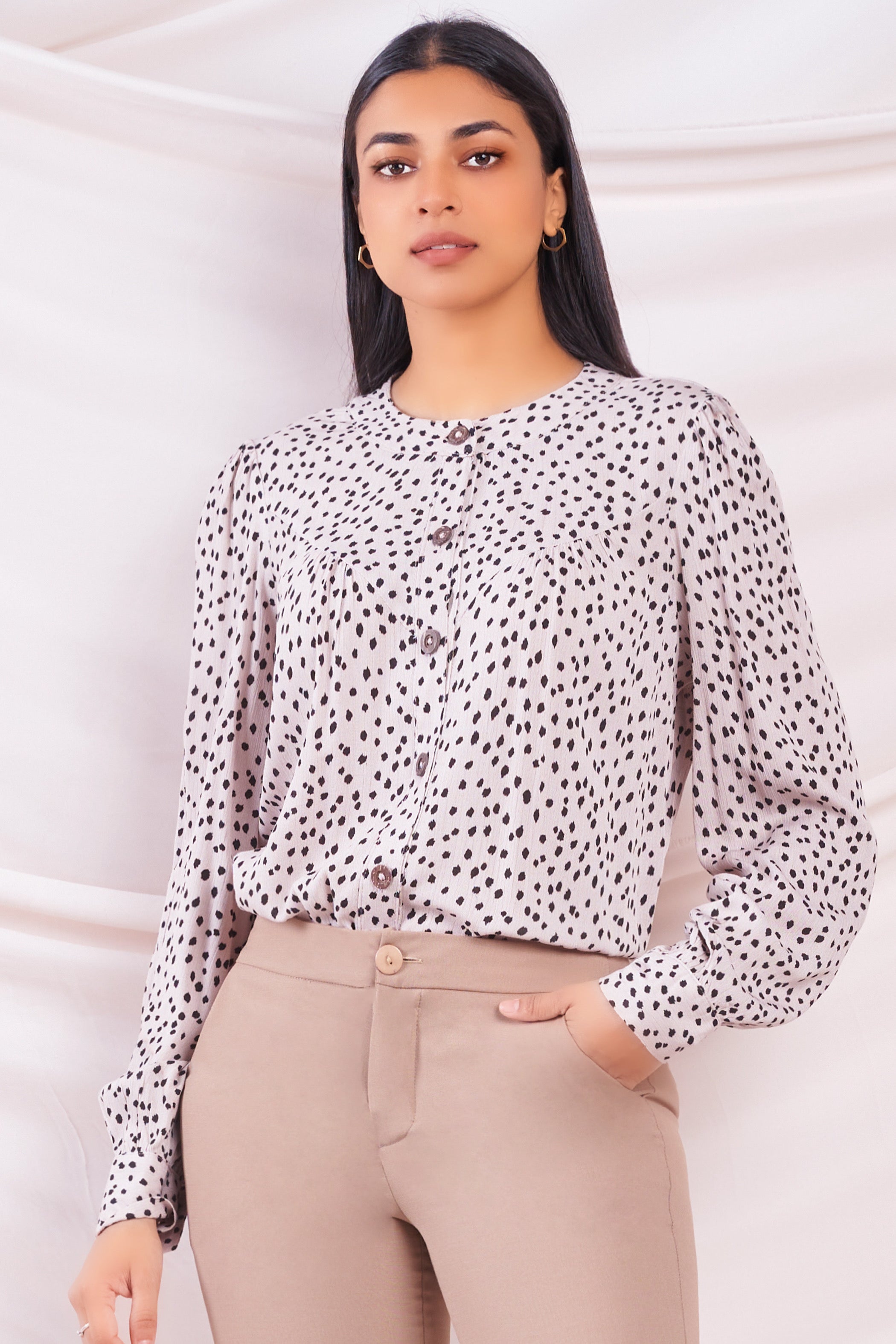 beige polka dot top